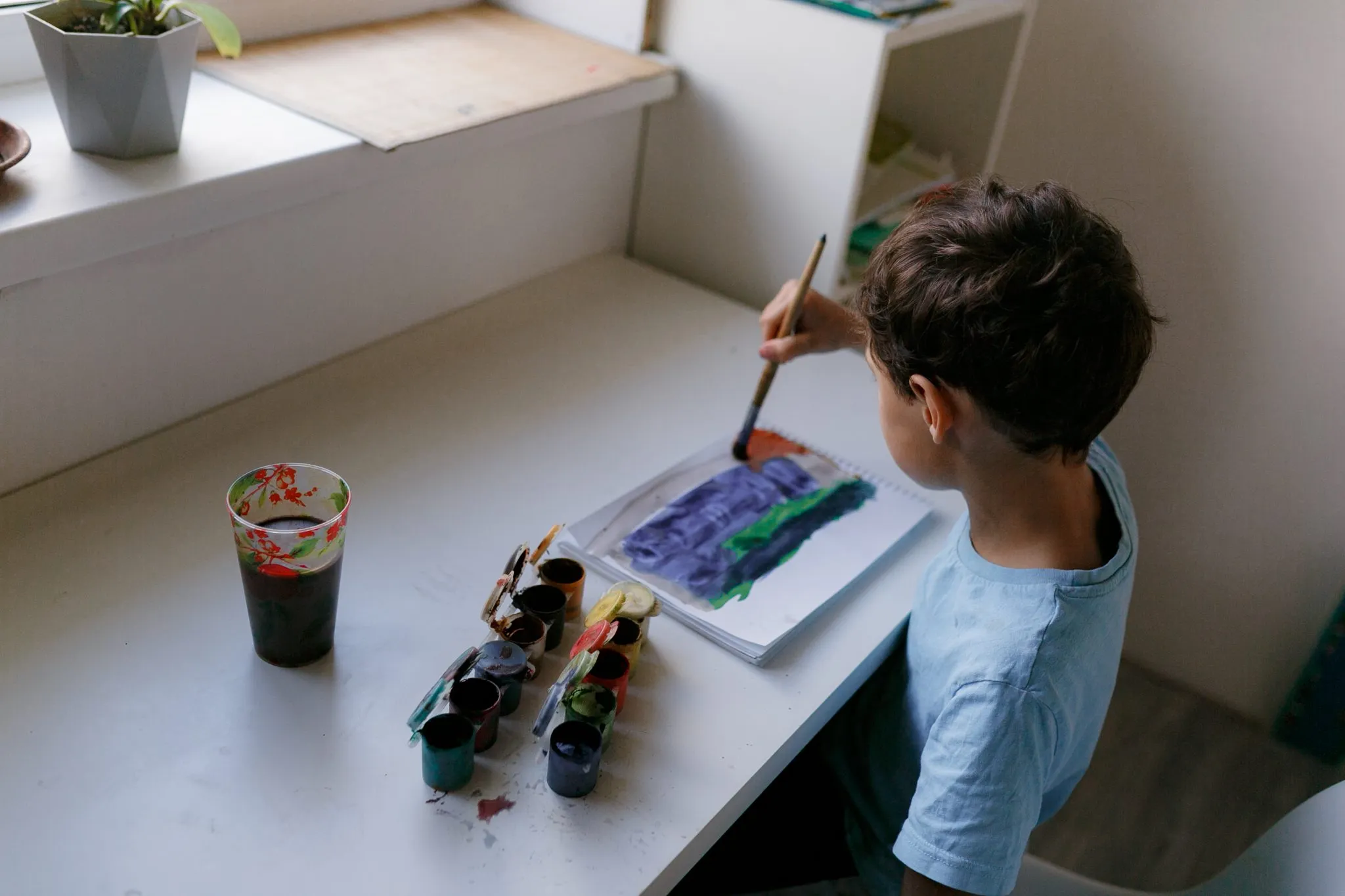 high angle view boy painting home 2048x1365 1