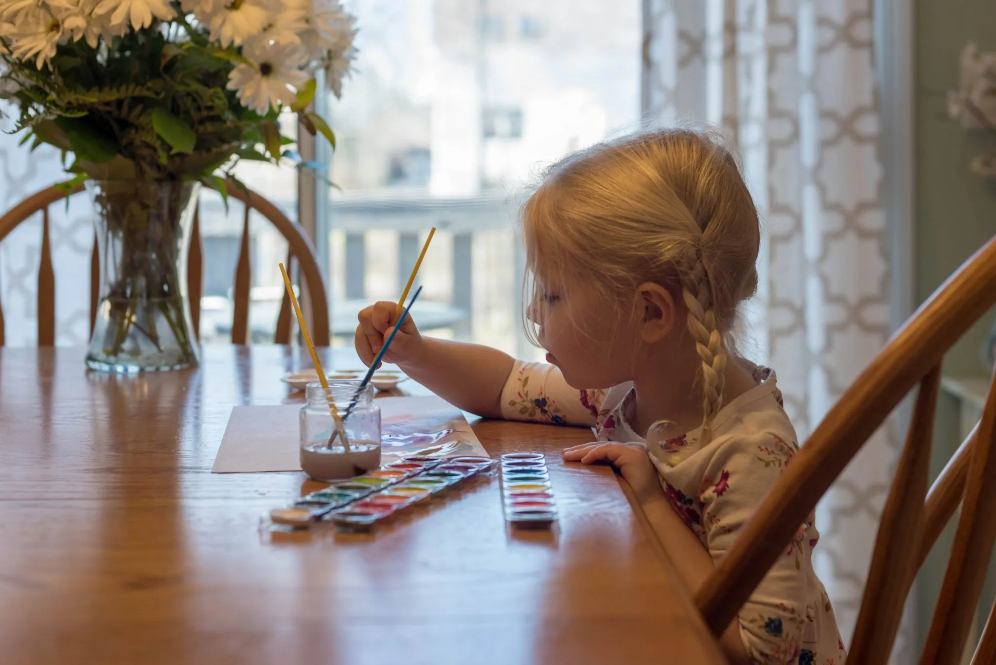 portrait girl sitting table home 2048x1367 1