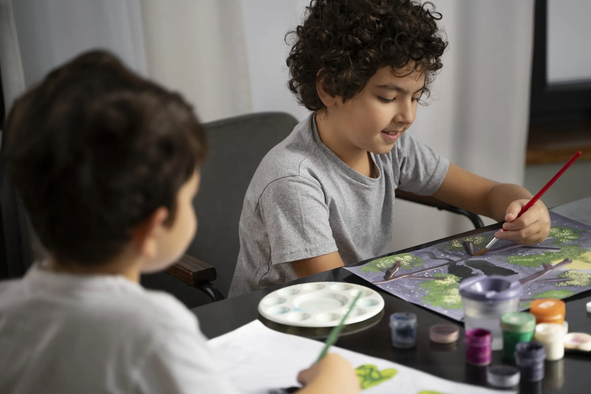young kids painting with watercolor 2048x1366 1